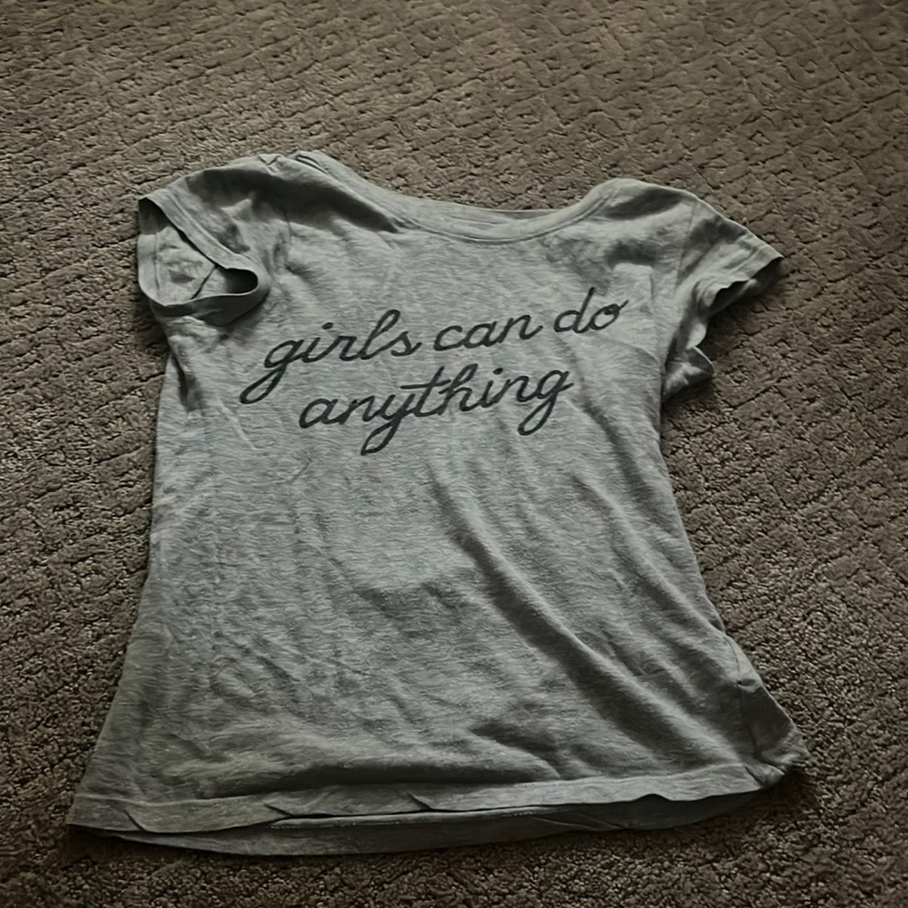 T-shirt size small from target that says girls can do anything in cursive!